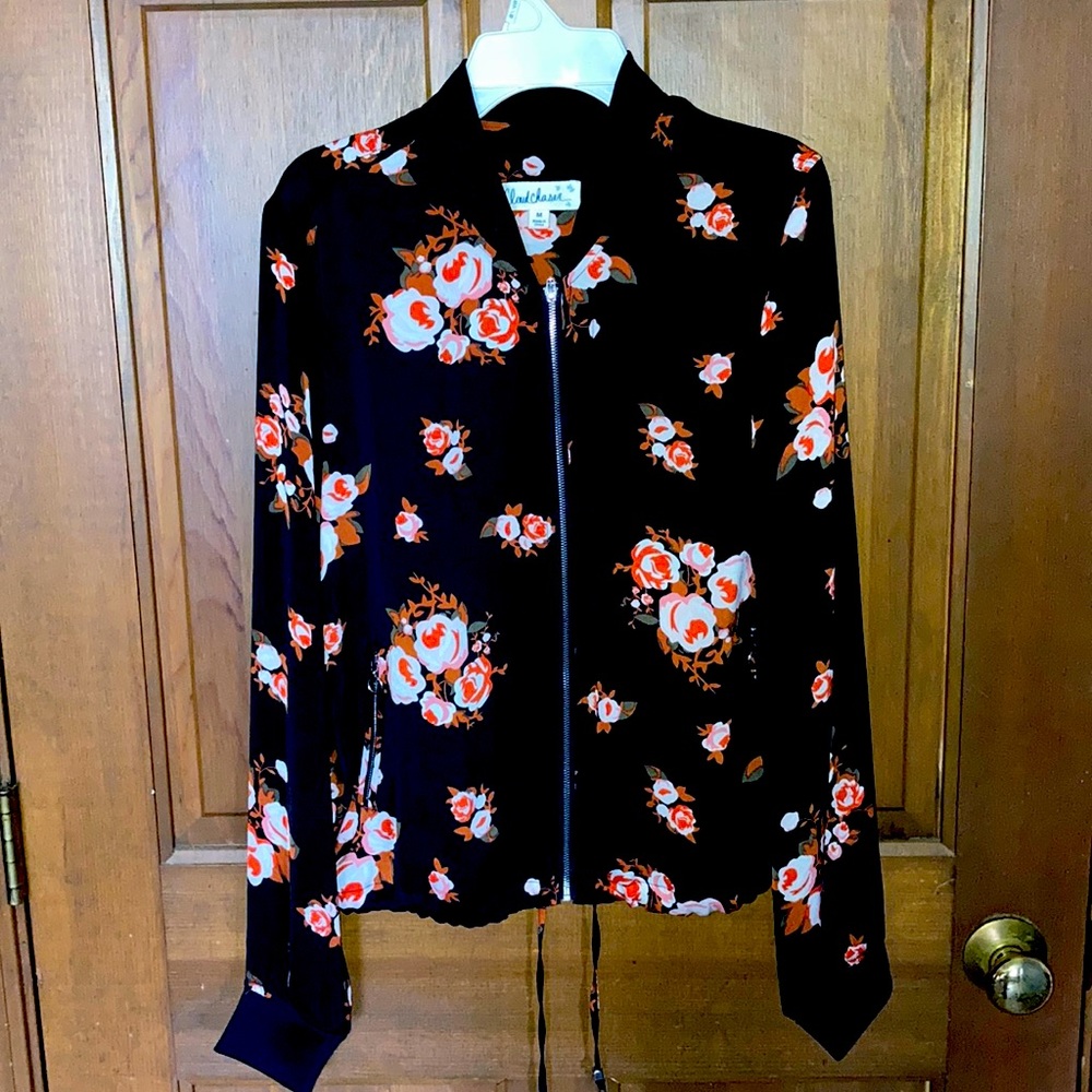 Sheer black and floral jacket.